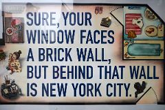 New York City Sign Sure Your Window Faces A Brick Wall, But Behind That Wall Is New York City